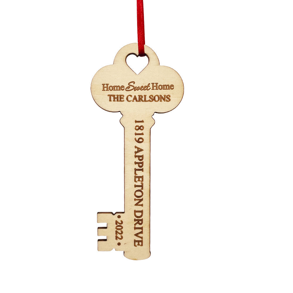 Personalized Wooden Key Christmas Ornament - Housewarming Gift, featuring custom text and a red ribbon.